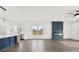 Open concept living room featuring hardwood floors, a fireplace, and a view into the gourmet kitchen at 4055 Miller Rd, Salisbury, NC 28147