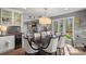 Bright dining area featuring modern lighting and access to the backyard at 420 Medearis Dr, Charlotte, NC 28211