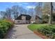 Beautiful home featuring a circular driveway, well-manicured lawn, and lush landscaping at 420 Medearis Dr, Charlotte, NC 28211