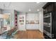 Well-lit kitchen showcasing white cabinets, modern appliances, and hardwood floors at 420 Medearis Dr, Charlotte, NC 28211