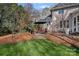 Outdoor patio area with comfortable seating and a built-in grill at 420 Medearis Dr, Charlotte, NC 28211