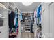 Spacious walk-in closet with ample shelving and hanging space for organized storage at 420 Medearis Dr, Charlotte, NC 28211