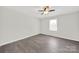 A brightly lit bedroom with a ceiling fan and luxury vinyl plank flooring at 430 Stoneycreek Ln, Rock Hill, SC 29730