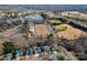 Aerial shot of a community with a school, sports fields, and neighborhood homes at 514 Nixon Rd, Belmont, NC 28012