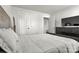 Bright bedroom featuring a white duvet, white double doors and a dark dresser at 514 Nixon Rd, Belmont, NC 28012