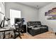 This bedroom features a cozy seating area, desk, and a comfortable leather sofa, ideal for work and relaxation at 514 Nixon Rd, Belmont, NC 28012