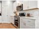 Gourmet kitchen featuring stainless steel appliances and herringbone backsplash at 514 Nixon Rd, Belmont, NC 28012