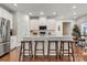 Spacious kitchen with stainless steel appliances, white cabinets, and breakfast bar at 514 Nixon Rd, Belmont, NC 28012