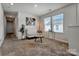 Well-lit living room provides a cozy and inviting space with plush carpeting, modern decor and natural light at 514 Nixon Rd, Belmont, NC 28012