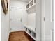 Bright mudroom features a bench, storage, and coat hooks, seamlessly blending function and style for everyday convenience at 514 Nixon Rd, Belmont, NC 28012