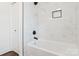 Bathroom showcasing new shower, white marble-style tile, and modern fixtures at 703 E Mills Dr, Landis, NC 28088