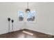 Bedroom with two windows, hardwood floors, and neutral decor at 703 E Mills Dr, Landis, NC 28088