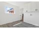 Clean laundry room with white cabinets, hookups, and a window for natural light at 703 E Mills Dr, Landis, NC 28088