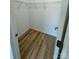 This closet features modern wire shelving and wood-style flooring at 705 Clara St, Gastonia, NC 28054