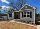 Attractive single-story home featuring gray siding and black shutters at 705 Clara St, Gastonia, NC 28054