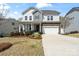 Charming two-story home with a manicured front yard, stone accents, and a welcoming front porch at 7200 Irongate Dr, Indian Land, SC 29707