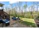Spacious backyard features a stone paver patio, green lawn and wooded views at 7200 Irongate Dr, Lancaster, SC 29720