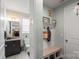 Cozy bathroom featuring a vanity with a granite countertop and a decorative mirror and is connected to the entry way at 7200 Irongate Dr, Lancaster, SC 29720