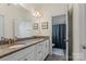 This bathroom features double sinks with granite countertops, modern fixtures, and tile flooring, offering a blend of style and functionality at 7200 Irongate Dr, Lancaster, SC 29720