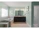 Luxurious bathroom with a soaking tub, a glass-enclosed shower, and a double sink vanity, creating a spa-like experience at 7200 Irongate Dr, Lancaster, SC 29720