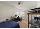 This bedroom features neutral walls, a ceiling fan, an ensuite bathroom, and ample space for both sleeping and working at 7200 Irongate Dr, Lancaster, SC 29720