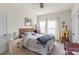 A bedroom with a ceiling fan, two windows, soft colors, and warm lighting to create a relaxing atmosphere at 7200 Irongate Dr, Lancaster, SC 29720