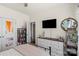 Bedroom with a stylish white dresser, a patterned accent door, and soft lighting that offers comfort at 7200 Irongate Dr, Lancaster, SC 29720
