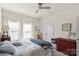 Cozy bedroom with two bright windows, soft bedding, and neutral colors that creates an inviting sanctuary at 7200 Irongate Dr, Lancaster, SC 29720