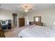 Spacious bedroom with carpet, dresser, desk, and a comfortable bed adorned with soft bedding and neutral decor at 7200 Irongate Dr, Lancaster, SC 29720