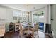 Bright dining area with a table and chairs adjacent to the kitchen and an outdoor patio through sliding glass doors at 7200 Irongate Dr, Lancaster, SC 29720