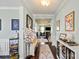 Welcoming foyer with hardwood floors, soft lighting, and stylish decor creates a warm and inviting entrance at 7200 Irongate Dr, Lancaster, SC 29720
