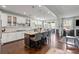 Spacious kitchen with a large island, stainless steel appliances, and an adjacent dining area and living room at 7200 Irongate Dr, Lancaster, SC 29720
