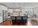 Well-appointed kitchen with stainless steel appliances, granite countertops, and pendant lighting over the large kitchen island at 7200 Irongate Dr, Lancaster, SC 29720