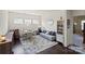 Cozy living room with hardwood floors, a patterned rug, a sofa, and a round table for versatile living at 7200 Irongate Dr, Lancaster, SC 29720