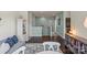A well decorated upper-level lounge area with sofa, bookshelves and table at 7200 Irongate Dr, Lancaster, SC 29720
