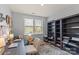 Home office featuring built-in bookshelves, a desk area, a comfortable chair, and a window for natural light at 7200 Irongate Dr, Lancaster, SC 29720