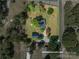 This aerial view showcases the property's expansive lot and the home's placement among lush greenery and neighborhood streets at 7271 Hallman Mill Rd, Vale, NC 28168