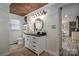 Updated bathroom featuring a modern vanity, stylish fixtures, and wood-look tile flooring at 7271 Hallman Mill Rd, Vale, NC 28168