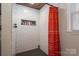 Bathroom shower with white subway tile and a decorative shower curtain at 7271 Hallman Mill Rd, Vale, NC 28168