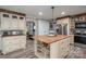 Well-equipped kitchen with a wooden island, stainless steel appliances, and plenty of counter space for cooking at 7271 Hallman Mill Rd, Vale, NC 28168