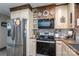 Kitchen featuring stainless steel refrigerator, updated appliances, and wood countertops at 7271 Hallman Mill Rd, Vale, NC 28168