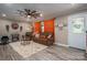 Cozy living room featuring neutral walls, wood-look floors, a ceiling fan, and comfortable seating area at 7271 Hallman Mill Rd, Vale, NC 28168