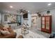 Inviting living room with wood-look floors, decorated walls, and a peek into the connected kitchen at 7271 Hallman Mill Rd, Vale, NC 28168