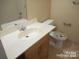 This bathroom features a neutral color scheme with a modern vanity at 8319 Golf Ridge Dr, Charlotte, NC 28277