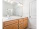 Bright bathroom features a double sink vanity, large mirror and a glass-enclosed shower at 8410 Scotney Bluff Ave, Charlotte, NC 28273