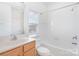 A bright bathroom with a shower-tub combo and a wood vanity at 8410 Scotney Bluff Ave, Charlotte, NC 28273