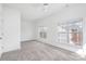 Spacious bedroom with neutral carpet, ceiling fan and windows that provide natural light at 8410 Scotney Bluff Ave, Charlotte, NC 28273