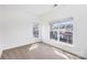 This carpeted bedroom has two windows offering a view of neighboring homes at 8410 Scotney Bluff Ave, Charlotte, NC 28273