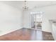 Bright dining room featuring hardwood floors, a chandelier, and access to an outdoor deck through sliding glass doors at 8410 Scotney Bluff Ave, Charlotte, NC 28273