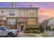 Charming two-story townhome with brick facade, well-maintained landscaping, and copper roof accents at 8410 Scotney Bluff Ave, Charlotte, NC 28273